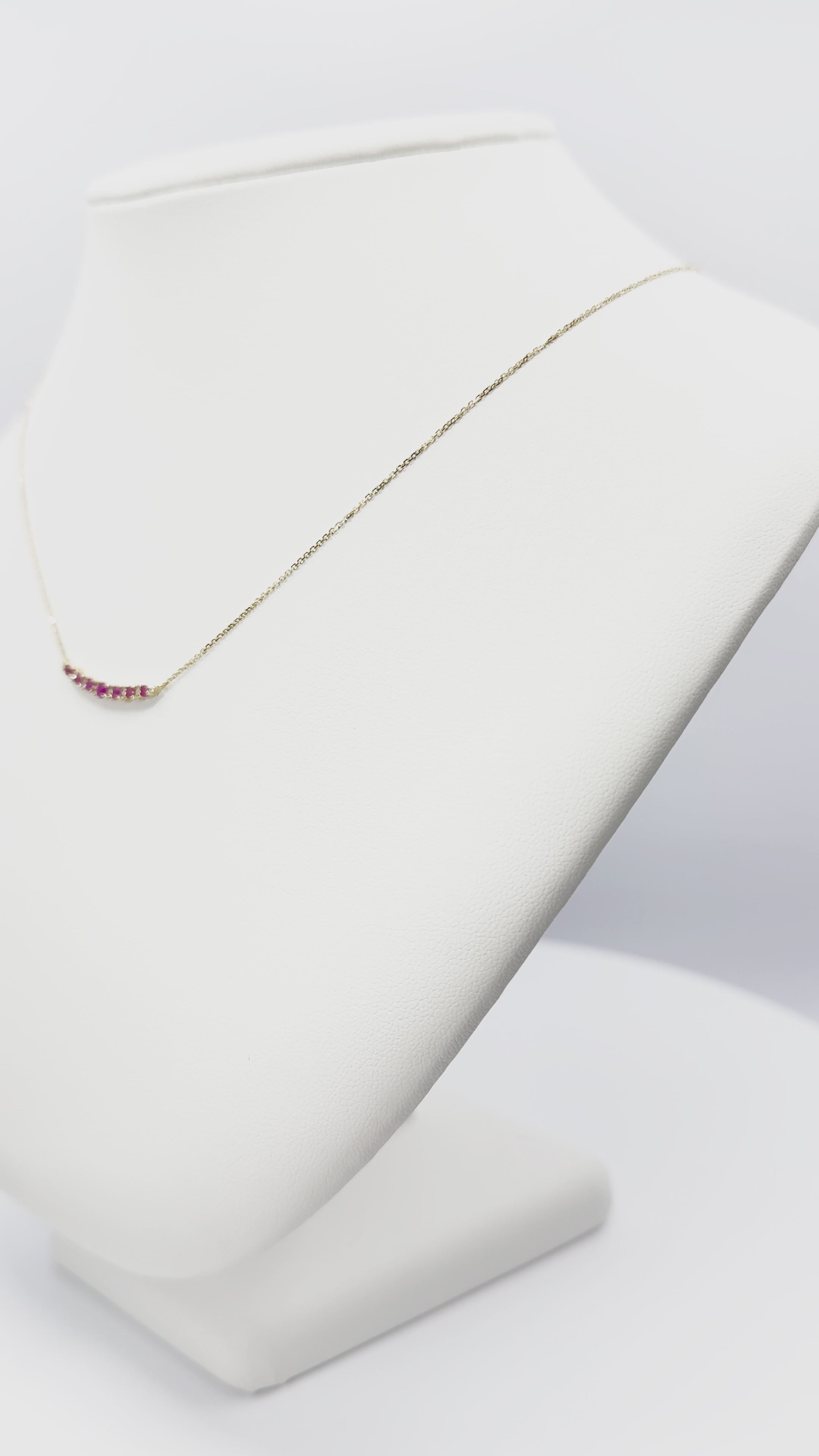 Load video: Ruby and Diamond Curved Bar Necklace in Gold 14K