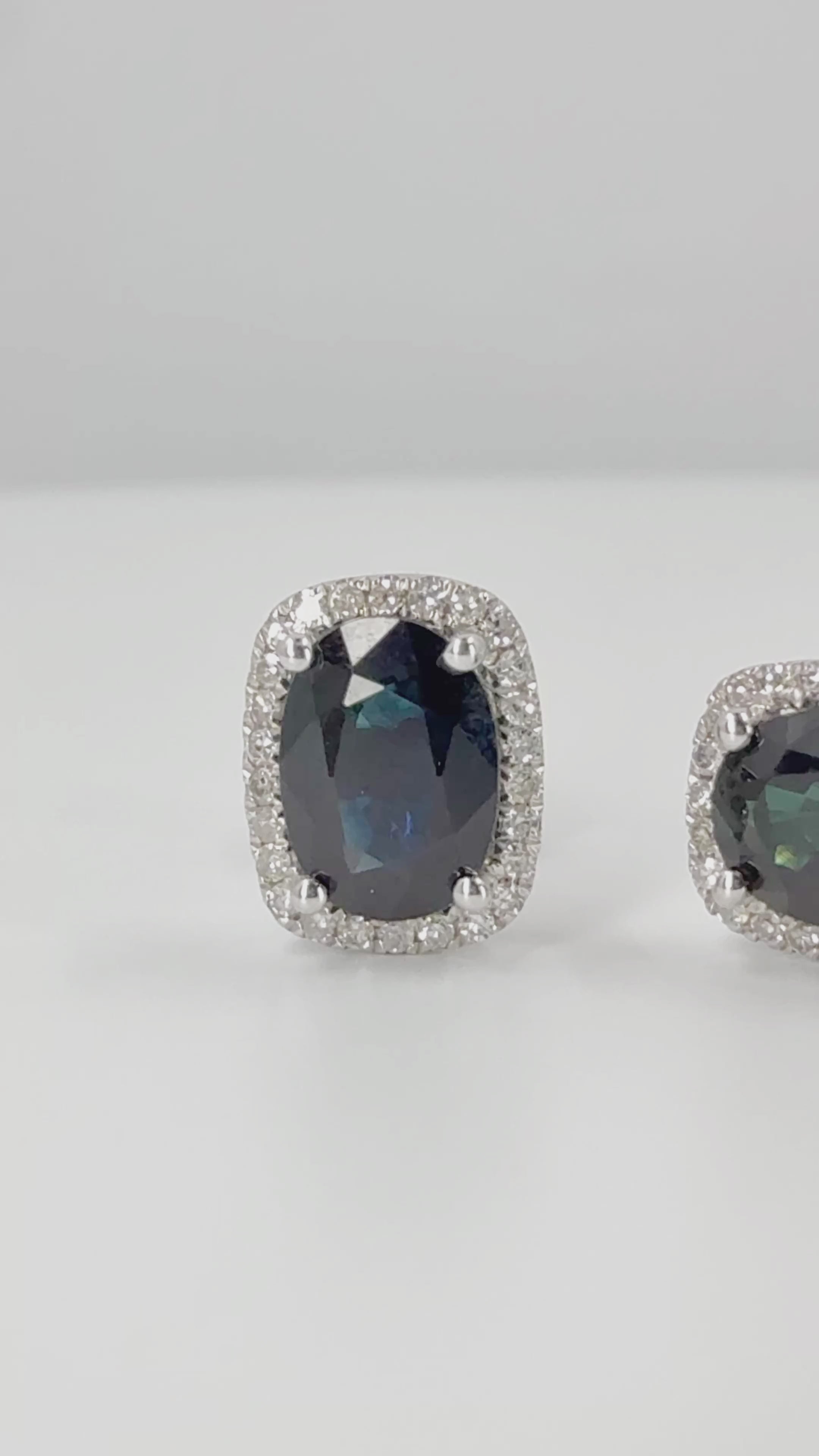 Load video: Oval Sapphire and Diamond Halo Earrings in 14K White Gold