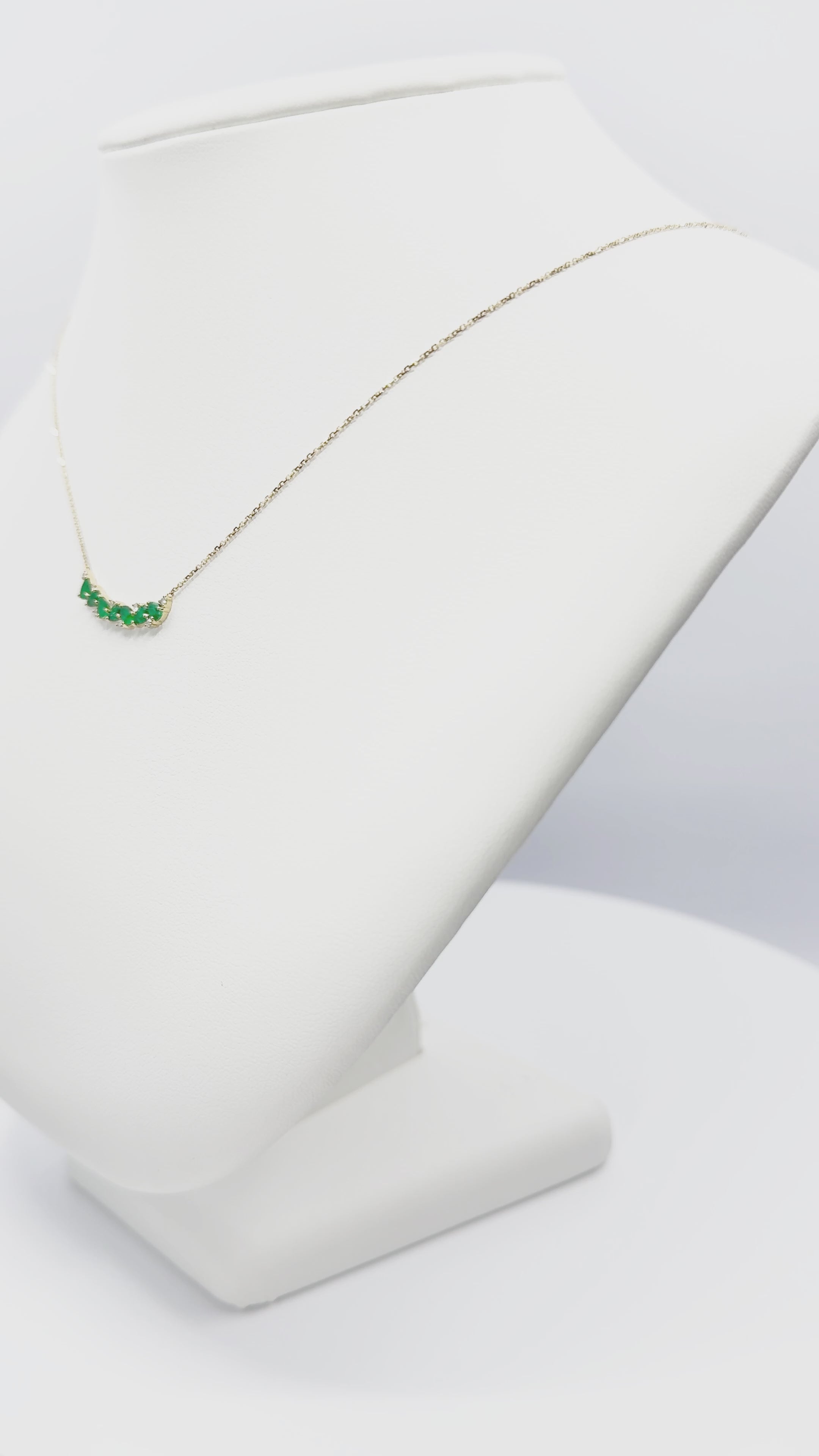 Load video: Emerald And Diamond Curved Bar Necklace in Yellow Gold 14K